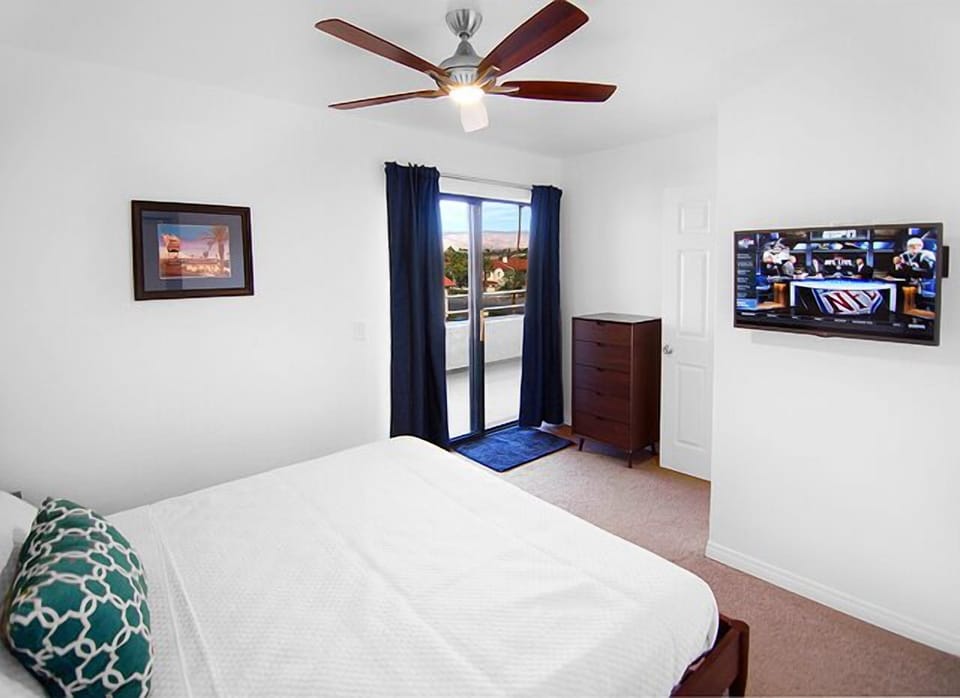 King Bed, 32"TV, 5 Drawer Dresser, Blackout Drapes & Patio Access from Bedroom