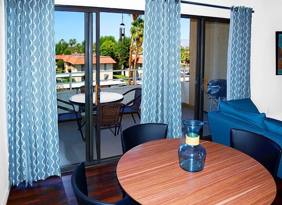 Dining Area Seats Four and Opens to Spacious Furnished Patio