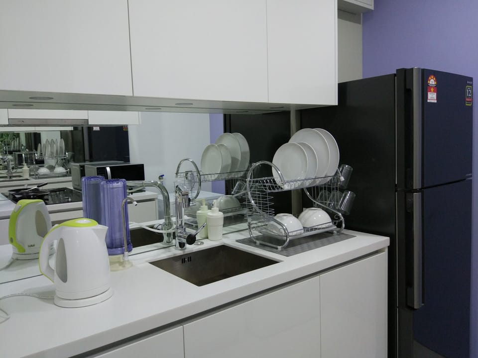 Kitchenette that comes with fridge and water filter.