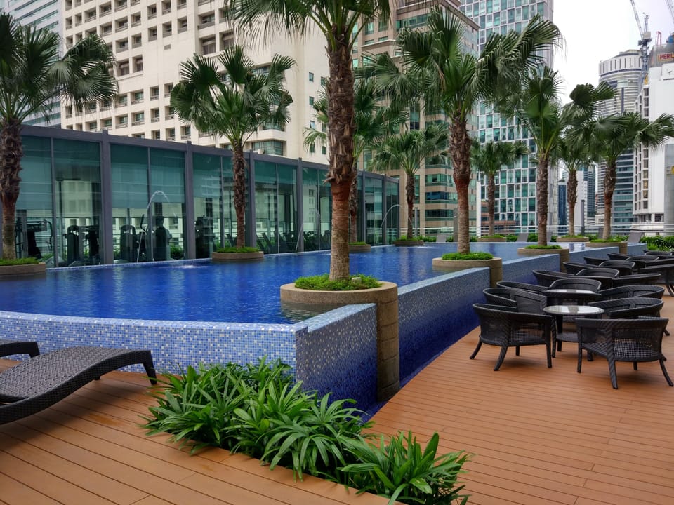 Relaxation area next to swimming pool 