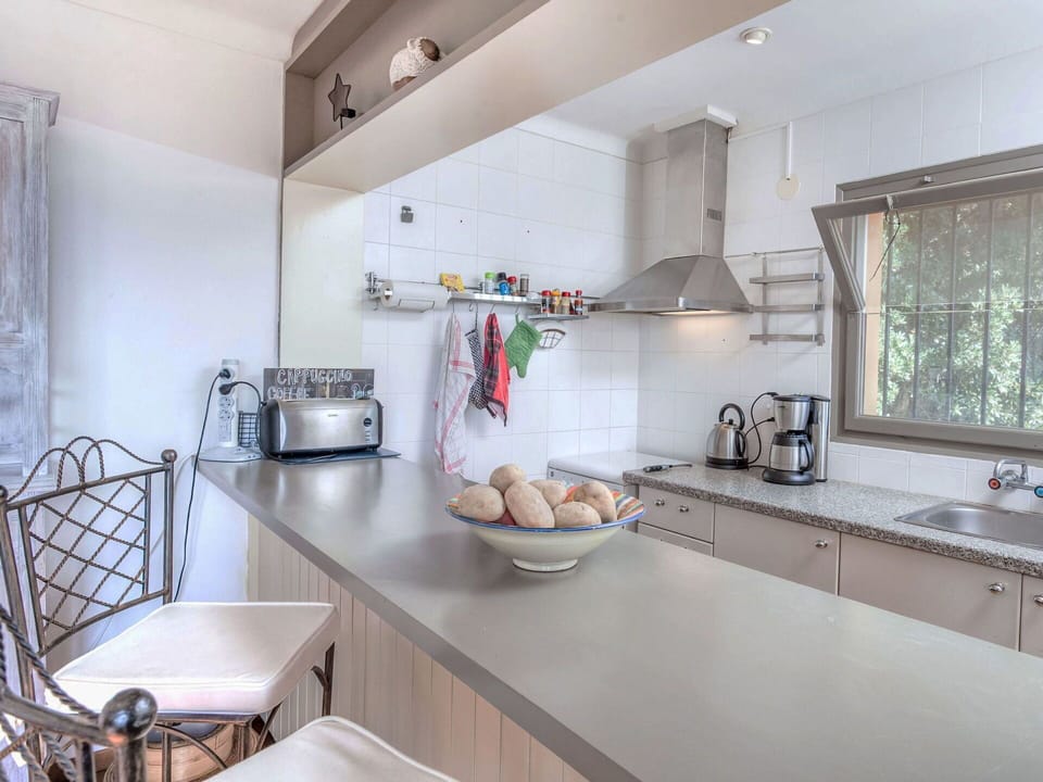 Kitchen, Countertop, Kitchen Appliance, Interior Design, Furniture, Cabinetry, Flooring, Wood, Major Appliance, Home Appliance