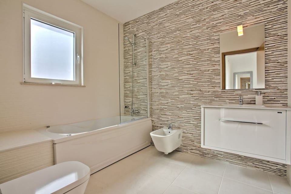Huge en-suite bathroom, with jacuzzi bath and shower over