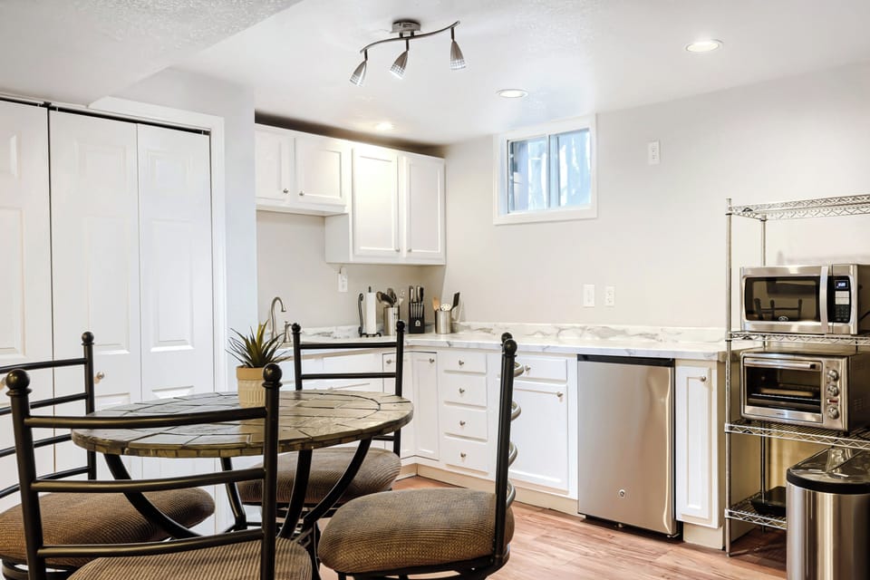 Kitchenette with breakfast nook, bar sink and mini fridge