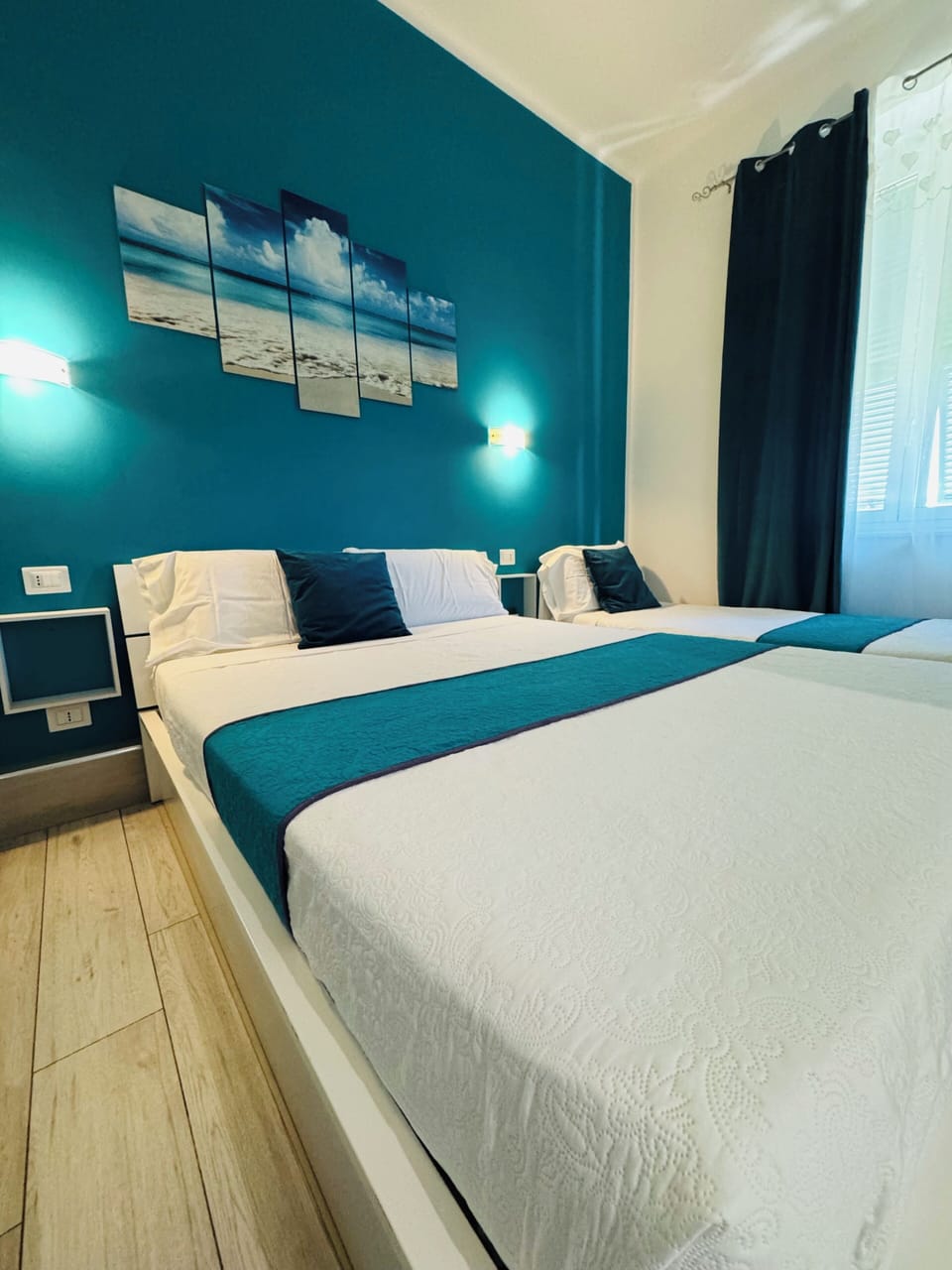 Triple Room, City View | Minibar, desk, blackout drapes, soundproofing