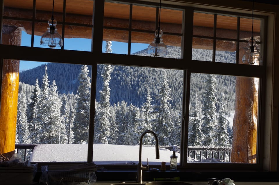 Hot tub/BBQ deck off the kitchen looking out at Green Mountain and the sunrise