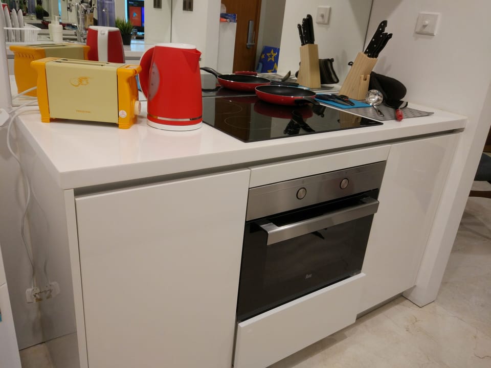 Kitchenette that comes with fridge and water filter.