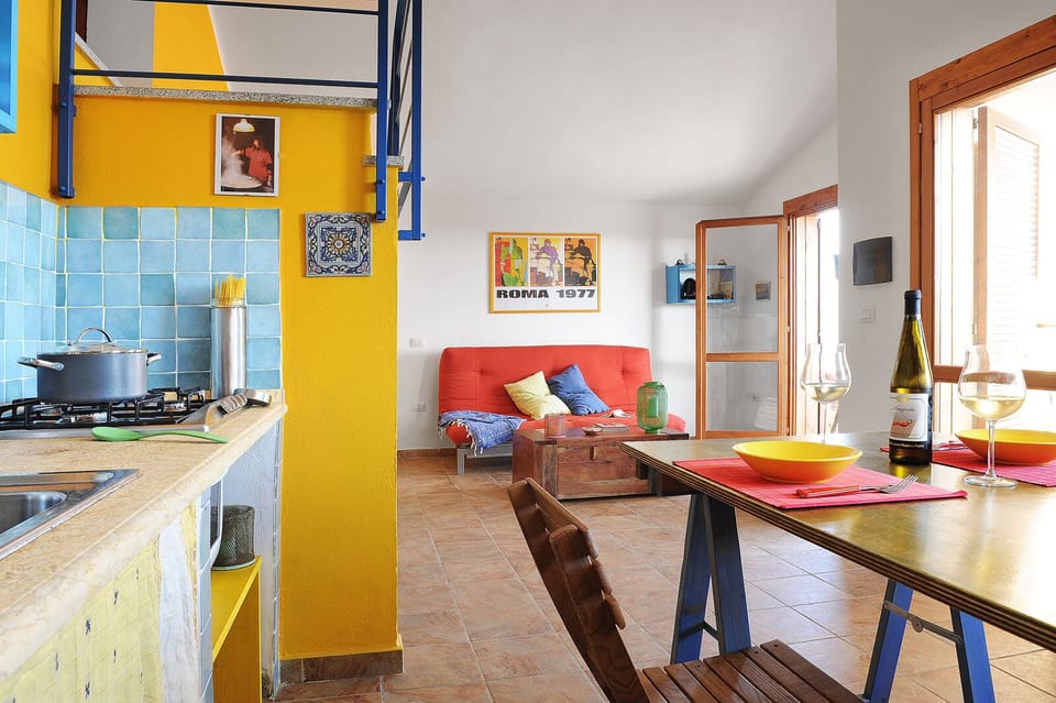 From the kitchen to the living. A couch with opens into a comfy bed.