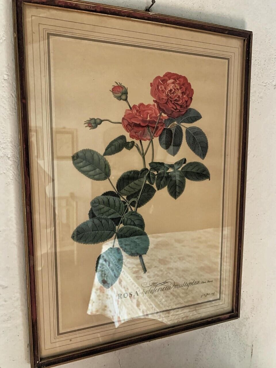 A lovely print with roses  in the master bedroom