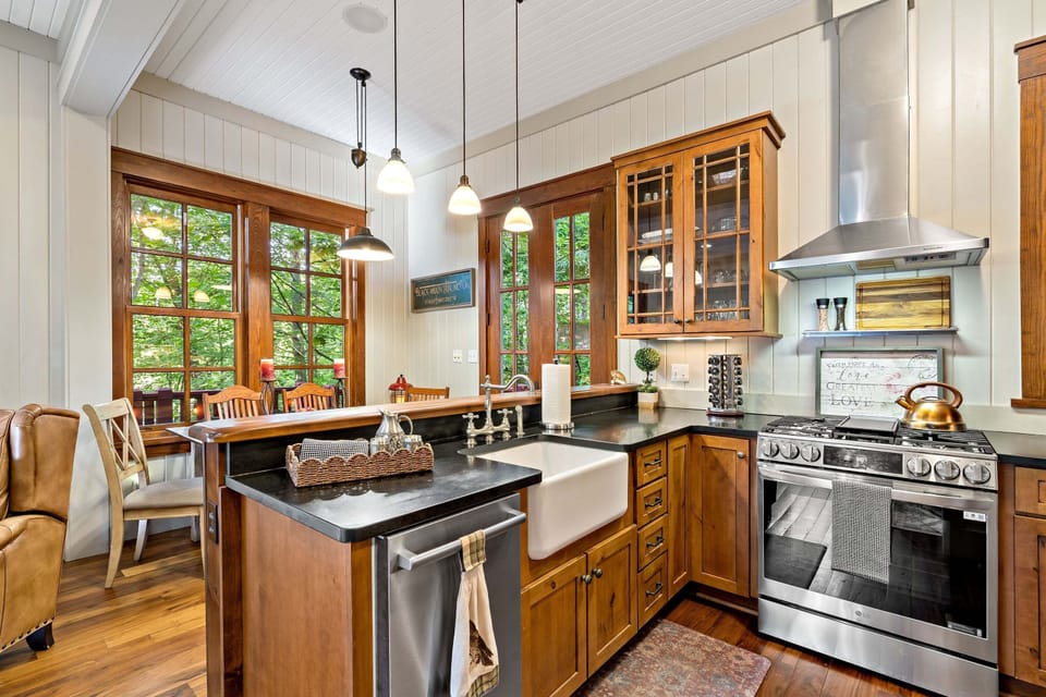 Kitchen with gas range stove, dishwasher, and drip-style coffeemaker.
