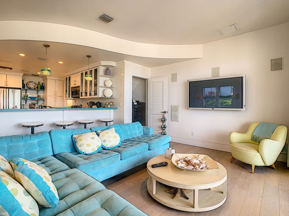 Main level living area towards kitchen space