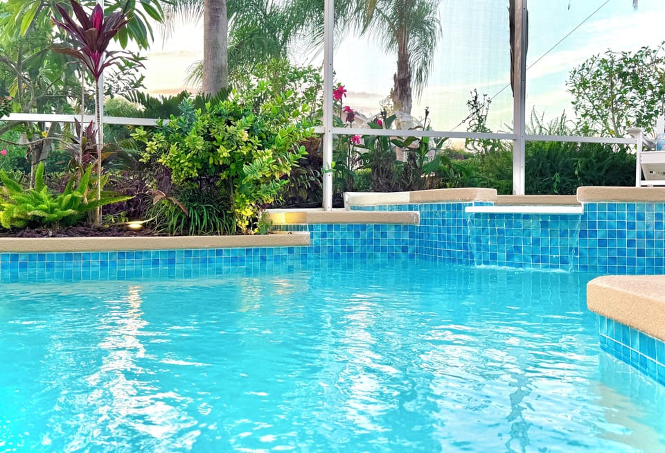Gorgeous backyard pool AND spa, with flower gardens, and private resort vibes!