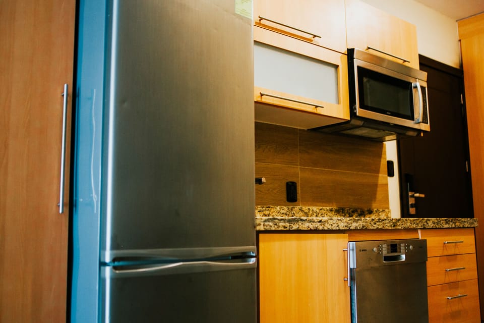 Junior Suite, 2 Queen Beds, Non Smoking | Private kitchen | Fridge, stovetop, cookware/dishes/utensils