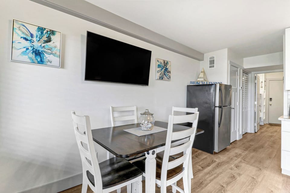 Dining area - Features a dining table and t.v.