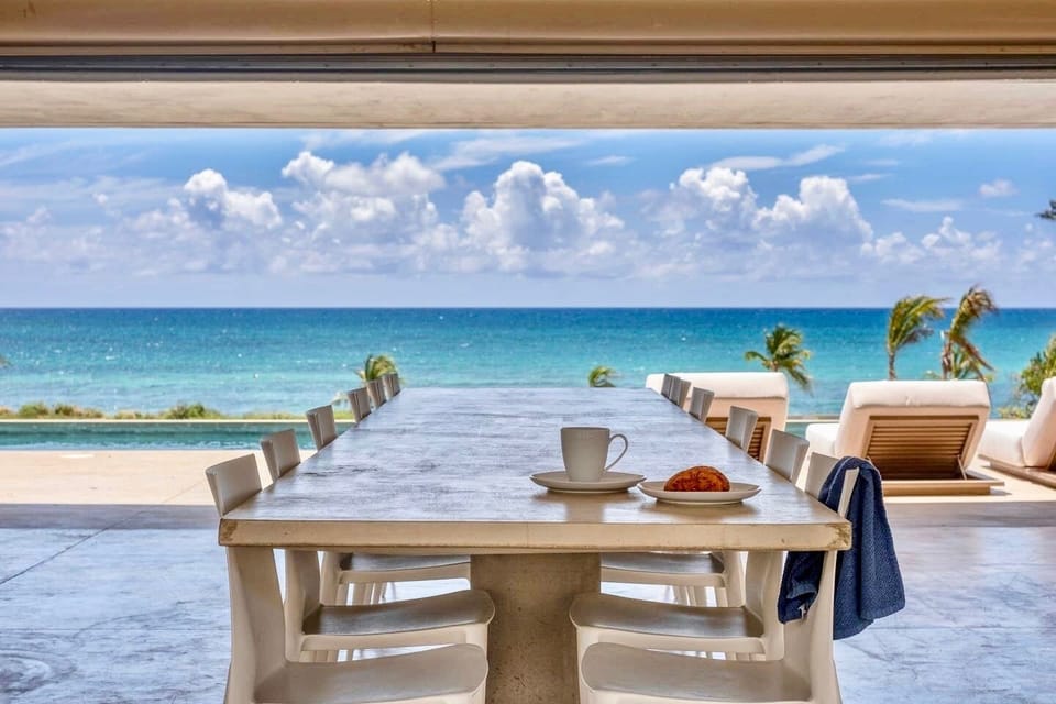 Built in concrete dining table with seating for 12  & water views to die for!