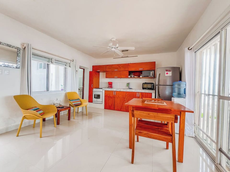 Bright kitchen and dining area overlooking the beachfront terrace