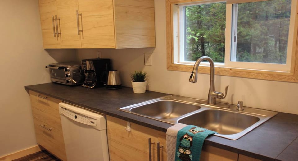Fully stocked kitchen with home essentials and small appliances for easy meals.