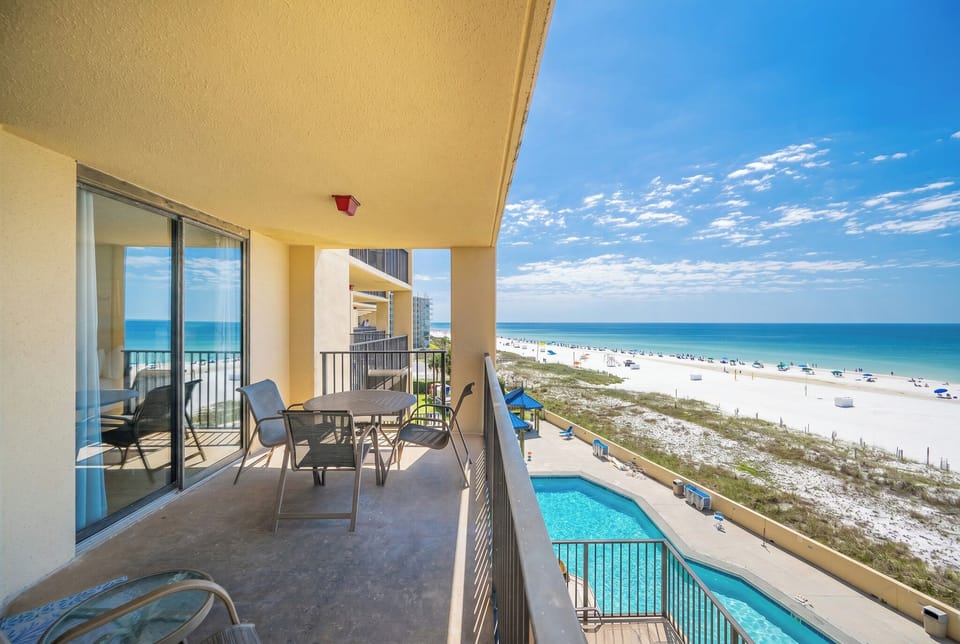 A gentle gulf breeze cools your skin as you relax on your balcony watching waves meet the beach below
