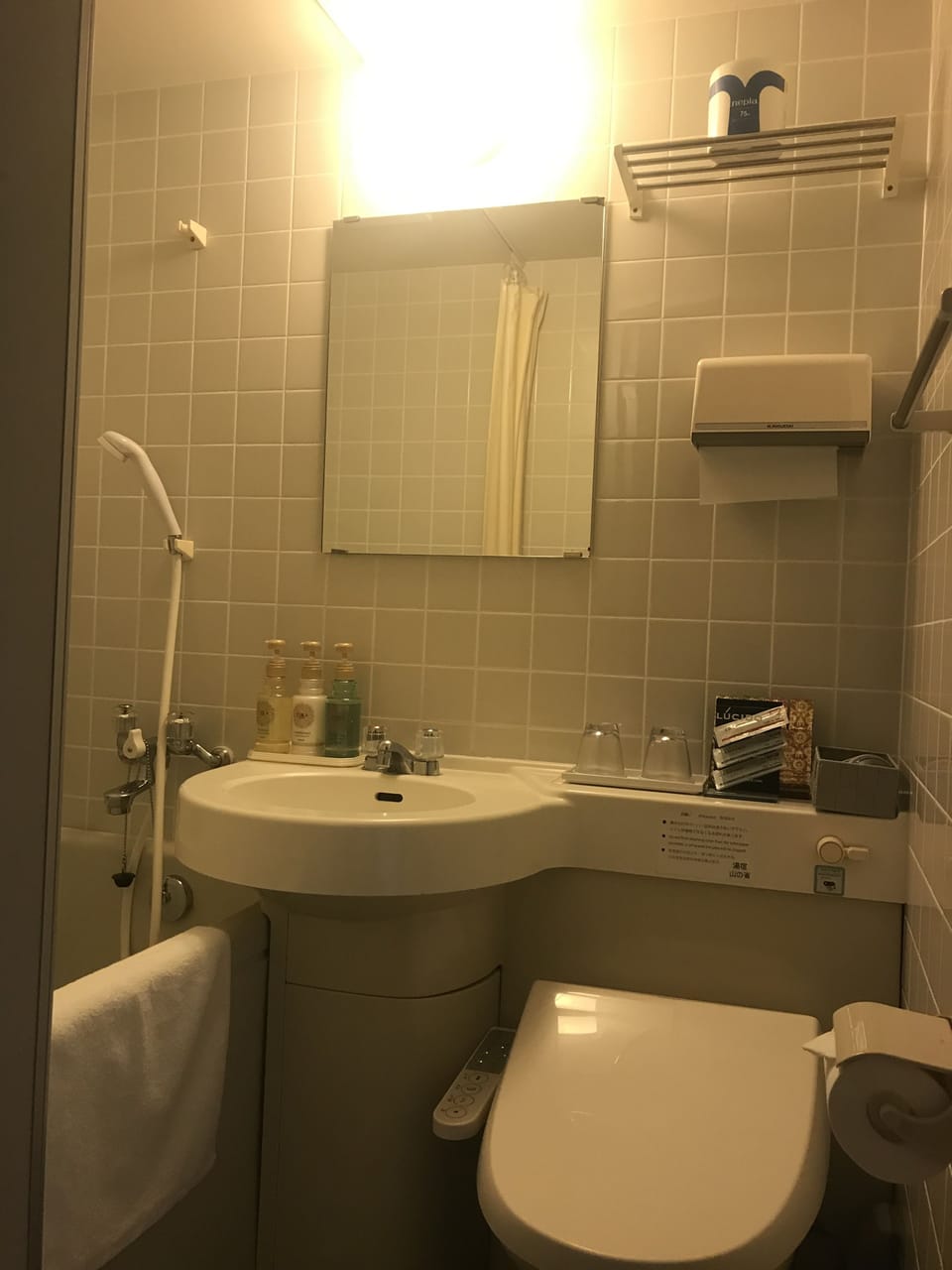 Combined shower/tub, free toiletries, hair dryer, slippers