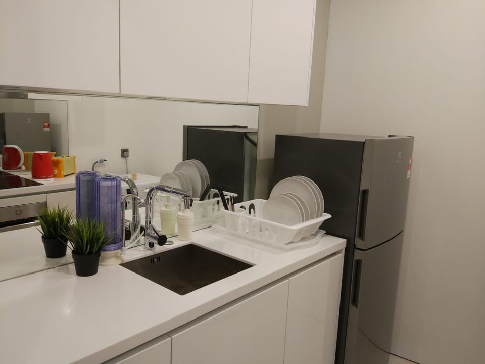 Kitchenette that comes with fridge and water filter.