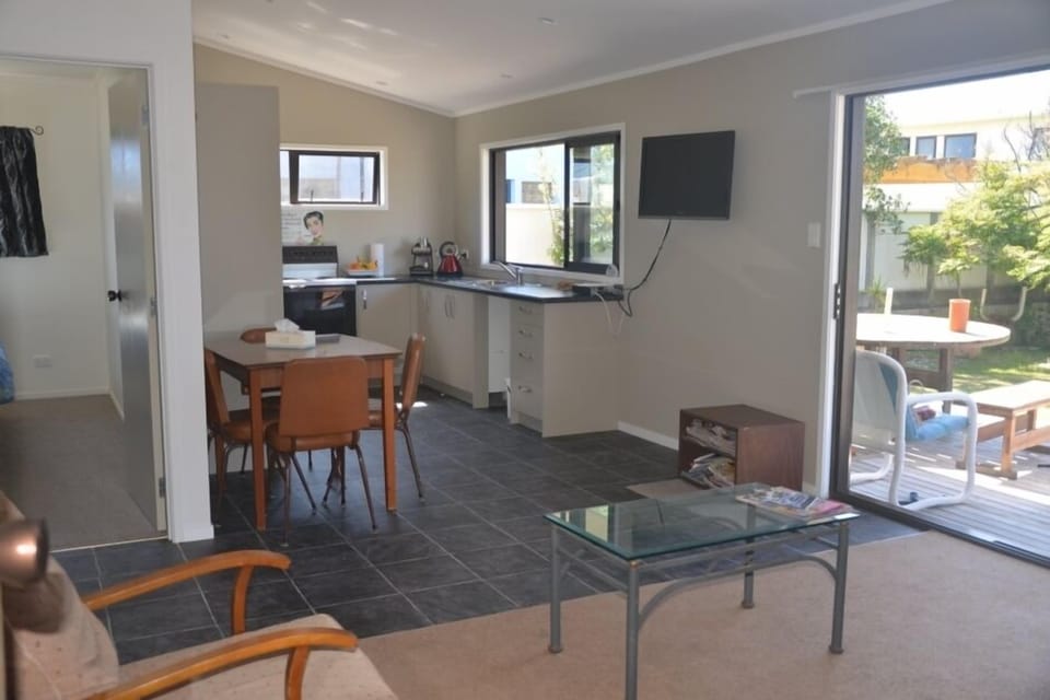 Lounge and kitchen with dining table