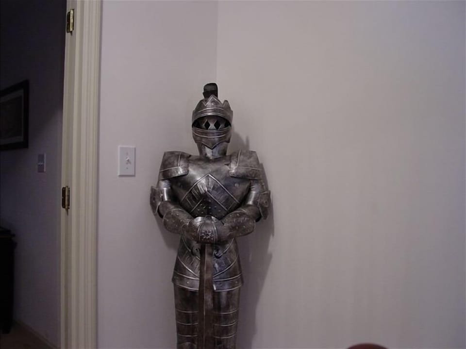 Knight in shining armor standing gaurd upstairs at the top of the steps!