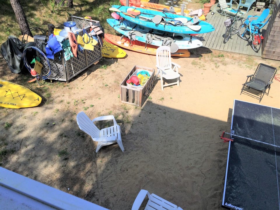 Out back - ping-pong, beach toys, rocking chairs..it's vacation time!