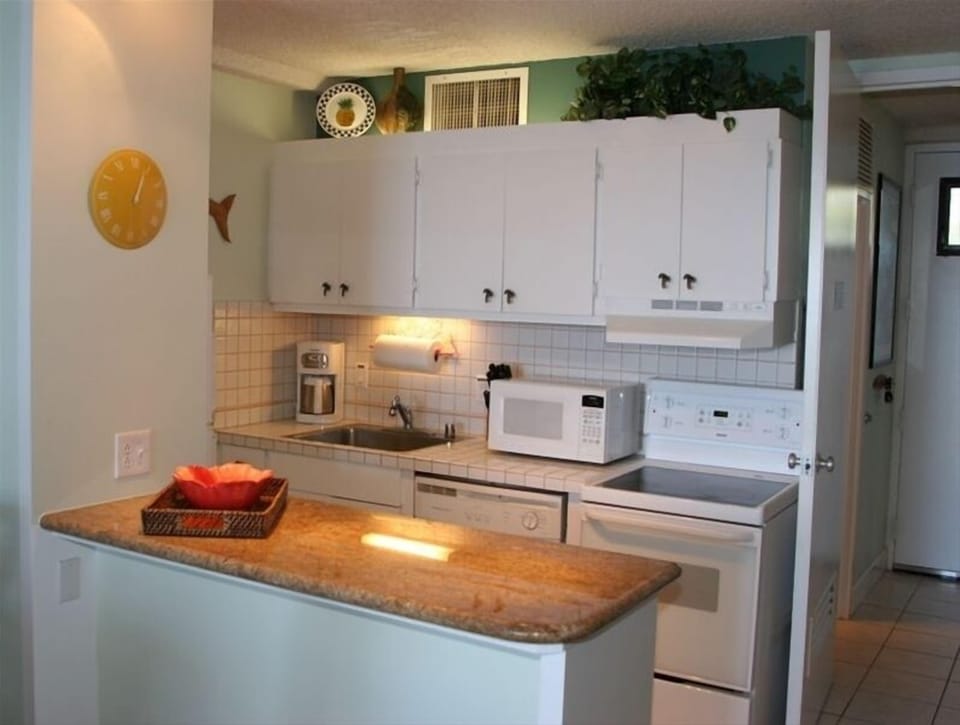 Our comfortable island-style retreat includes a fully stocked kitchen.