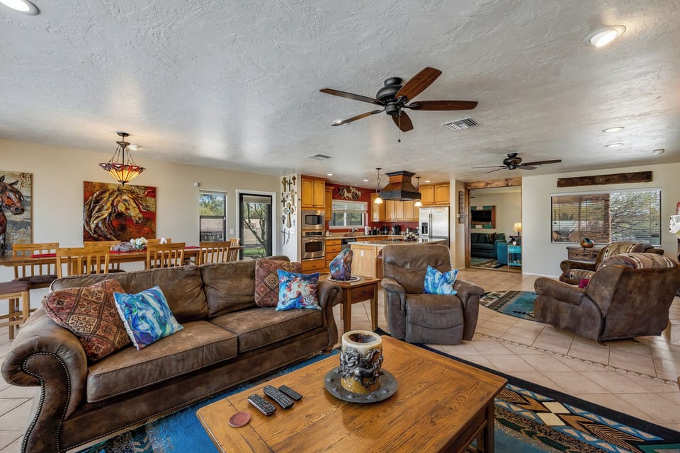 from TV showing couch and recliner back to kitchen area