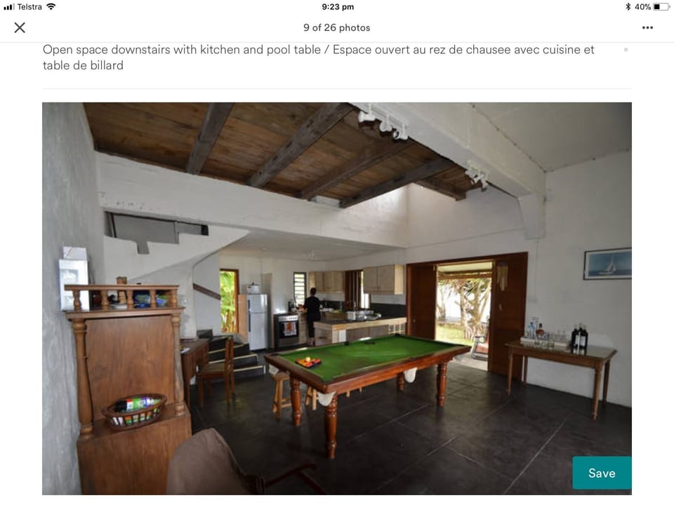 Open space kitchen and living room with pool  table 
