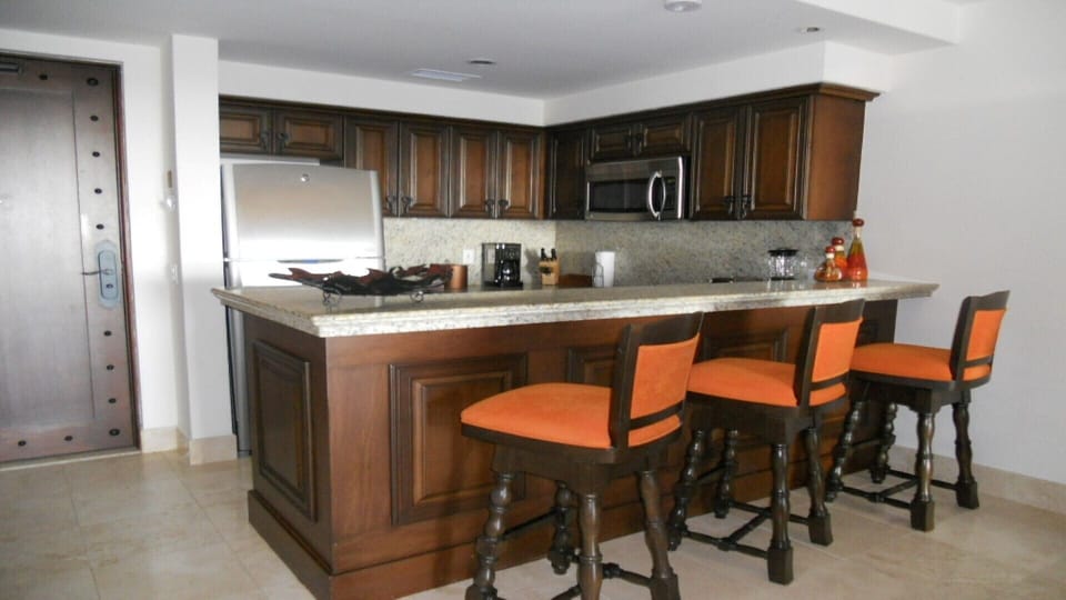 Kitchen and full sit up bar area