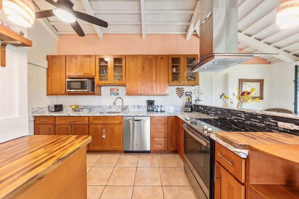 Spacious and fully equipped kitchen with stainless steel appliances for your convenience