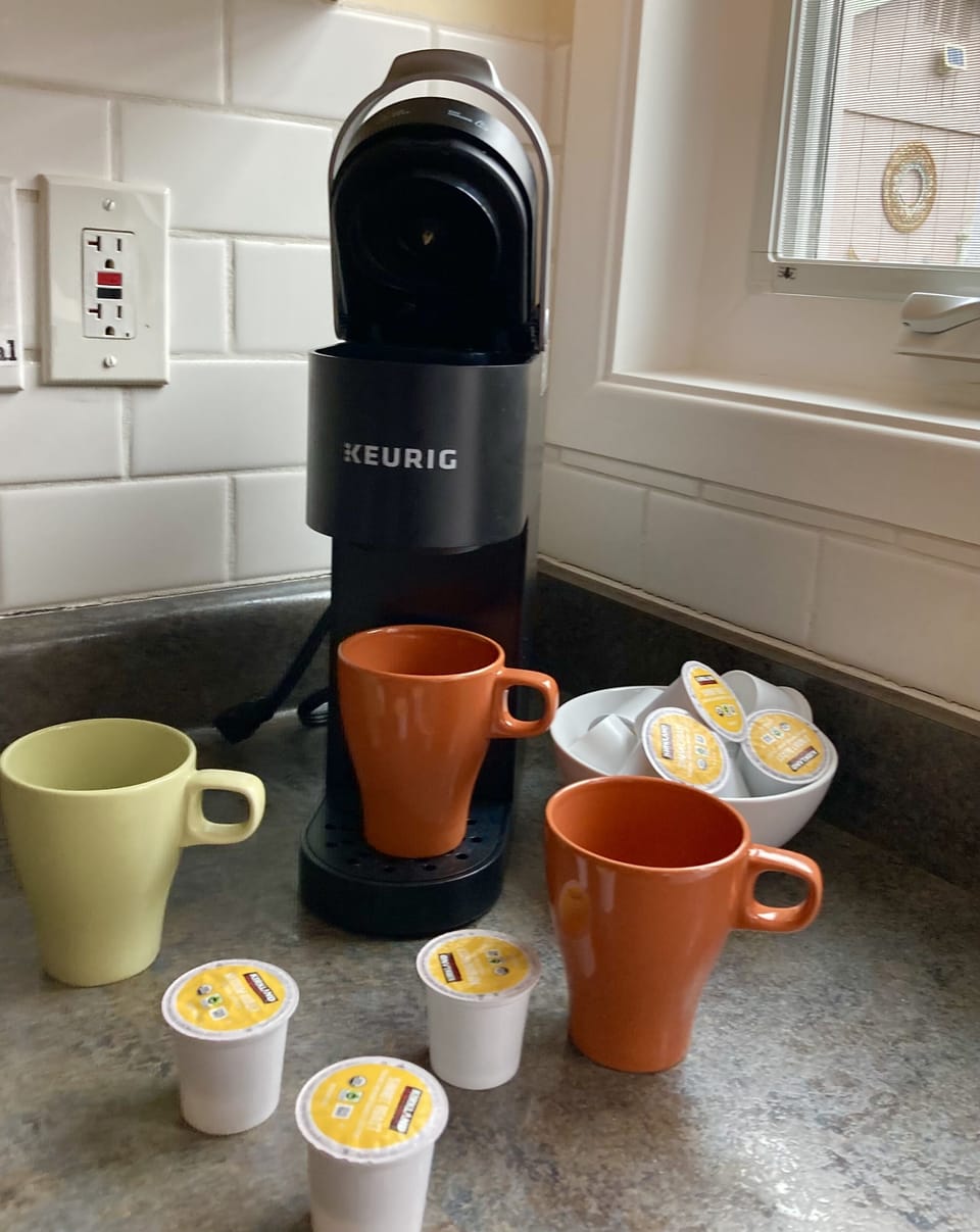 Keurig machine with coffee pods & creamers provided for your morning wake-up