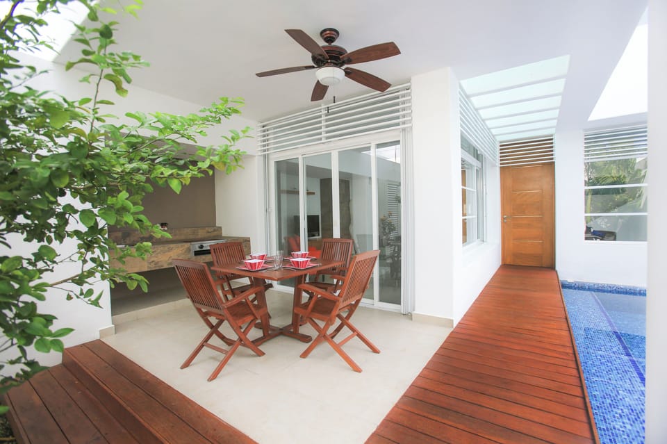 The view of the entrance, BBQ corner and pool