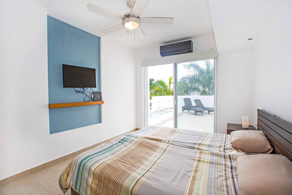 3rd bedroom upstairs with view of the patio
