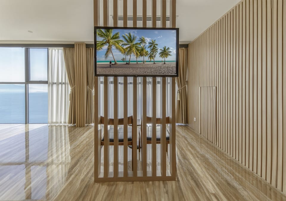 Suite, Ocean View | Living area | 23-inch flat-screen TV with cable channels, TV