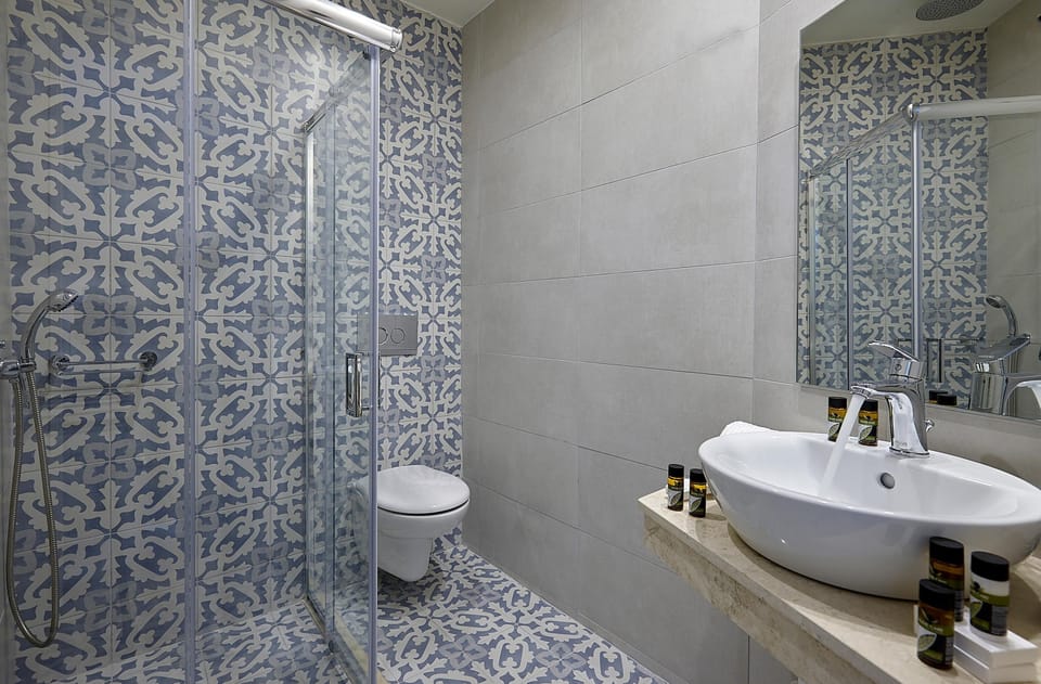 Designer toiletries, hair dryer, bathrobes, slippers