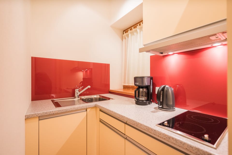Studio, Balcony, Garden View | Private kitchen | Full-size fridge, stovetop, toaster, cookware/dishes/utensils