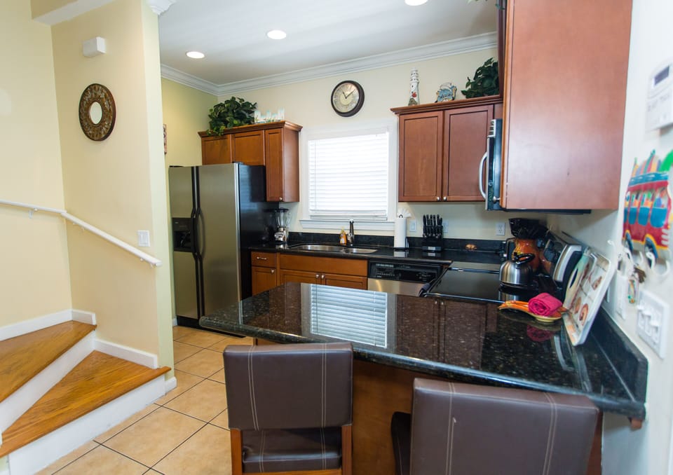 Fully stocked kitchen, full size ref. with ice maker, d/w, m/w, range, blender