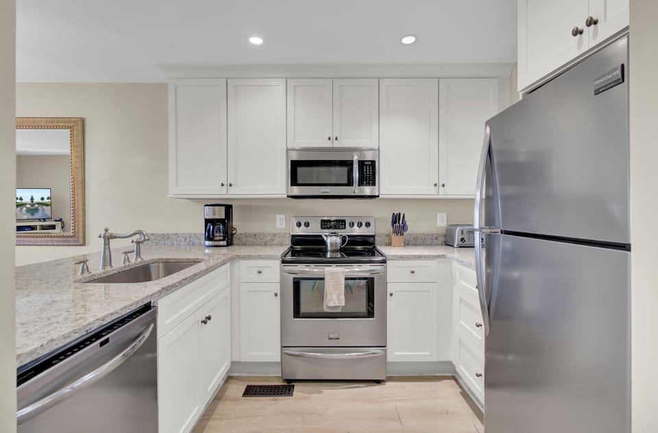 Your fully equipped kitchen features stainless steel appliances and granite countertops, perfect for preparing meals during your stay.