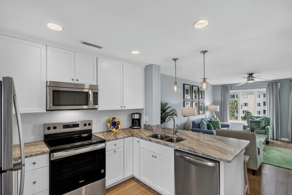 Enjoy your fully-equipped kitchen with granite countertops, stainless appliances, and an open flow into the stylish living area where you can relax and unwind.