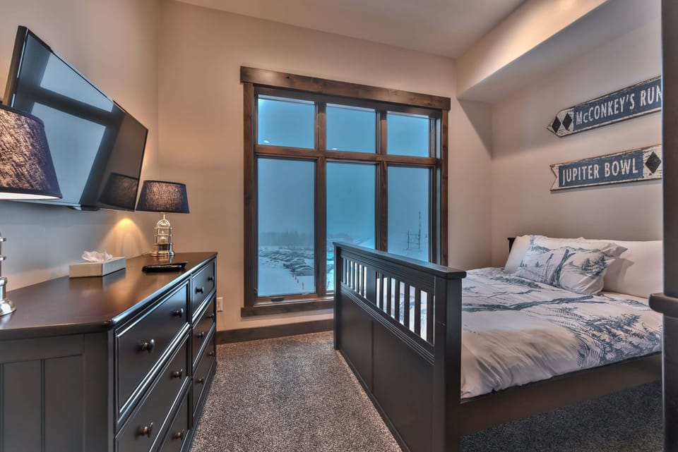 Bedroom 2 has a Full over Full Bunk Bed, a Full Bed and a Smart TV, Private Bath