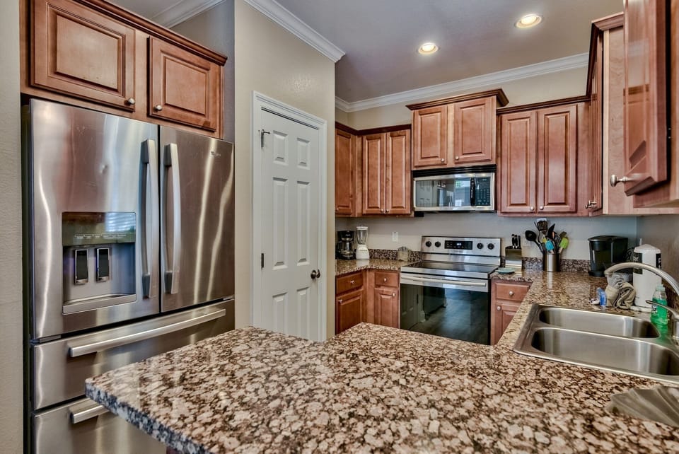 Kitchen has a full-sized refrigerator, coffee maker, stove, oven and more! All here to make meal prep a breeze!