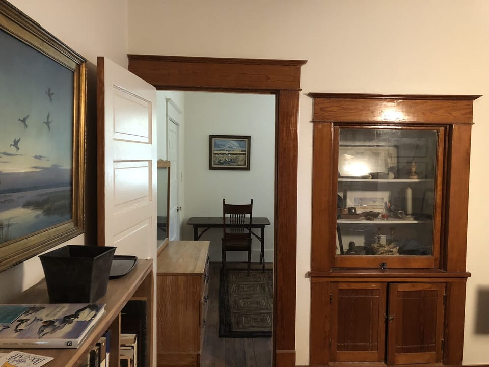 Doorway from dining room to rear bedroom.