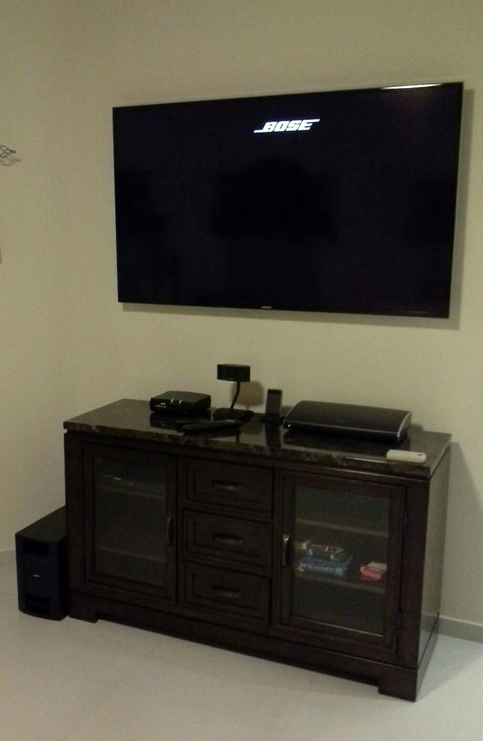 60inch HD TV along with DVD, IPOD Dock, and Bose Surround Sound  in living room