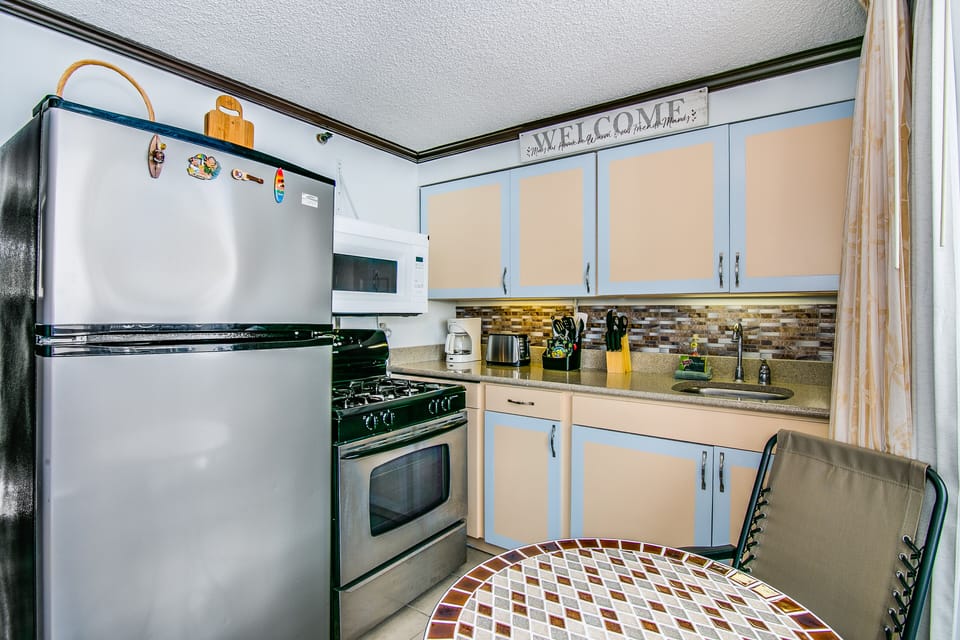 Full kitchen with large fridge and oven etc.