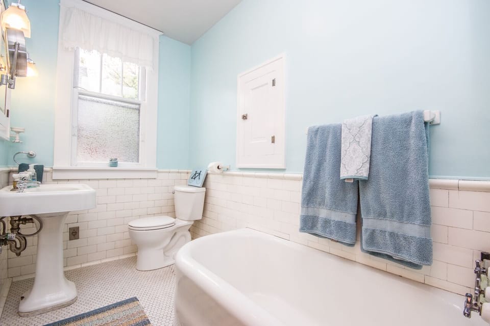 Upstairs bathroom with tub and shower