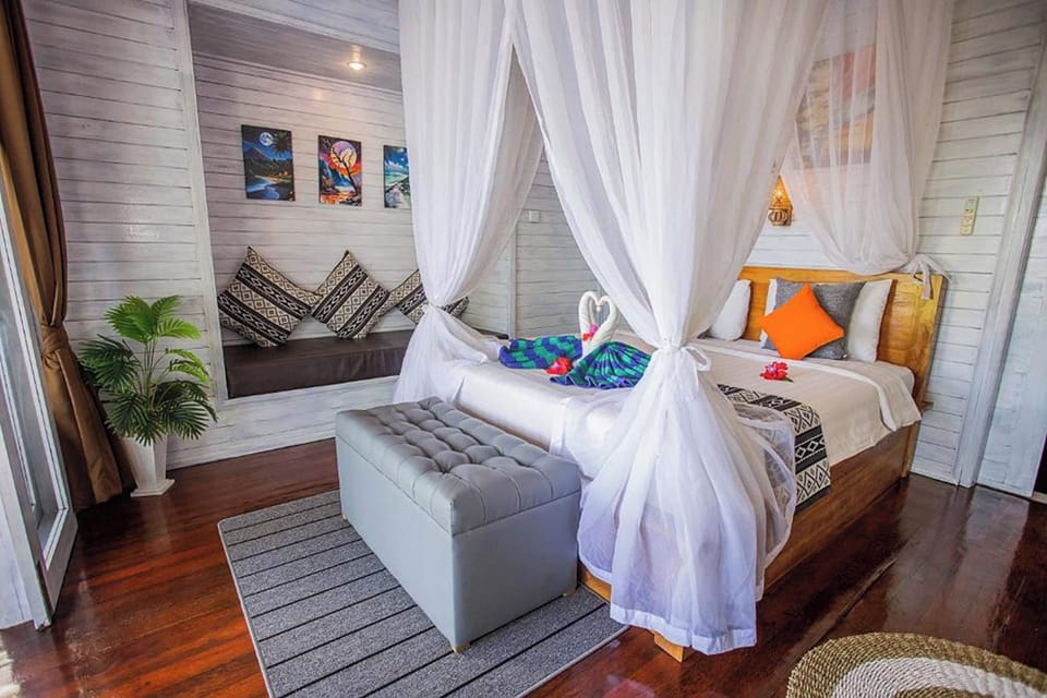 Deluxe Room, Pool Access, Sea View | 1 bedroom, minibar, in-room safe, desk