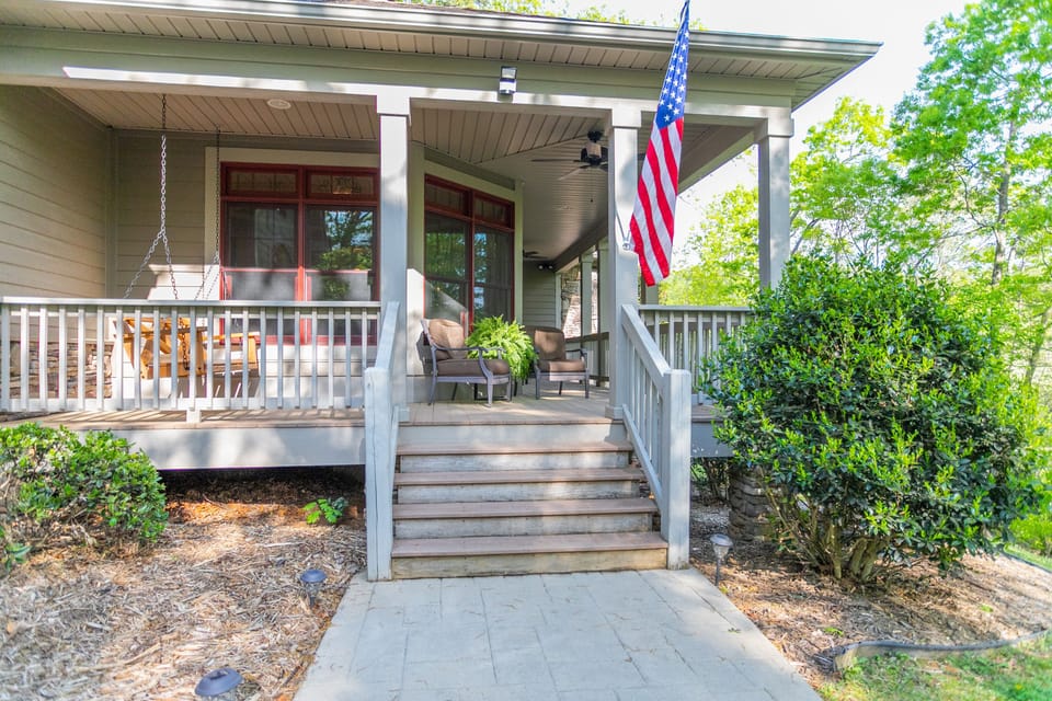 Covered porch with extra seating and porch swing. Several outdoor seating areas 