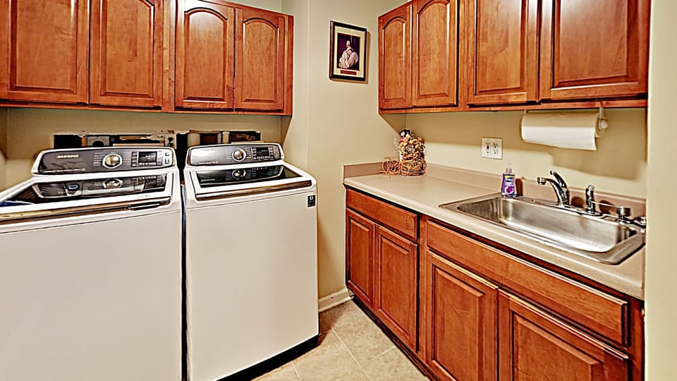 Two washers in the laundry room (two dryers in the adjacent garage landing)