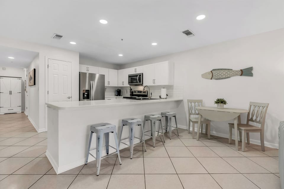 Kitchen Dinning area large bar and table area.